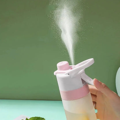 Large plastic spray water bottle with handle strap and leakproof lid in green colour.