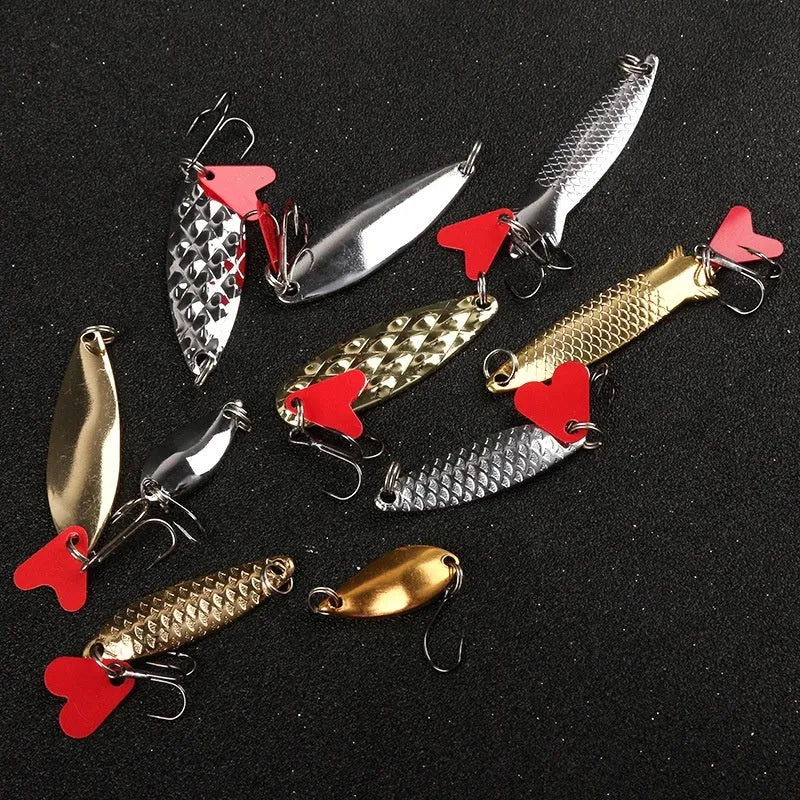 Iron pineapple fishing lure with metal sequin detailing in gold and silver colours