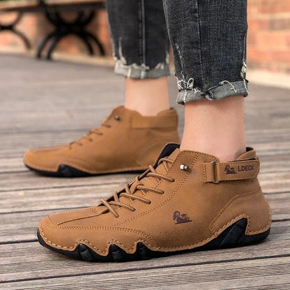 High top men's shoes in khaki with rubber soles and microfiber upper, showing round toe and middle tube height