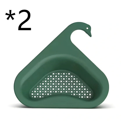 Yellow swan-shaped plastic kitchen drainer basket with drainage holes on kitchen counter