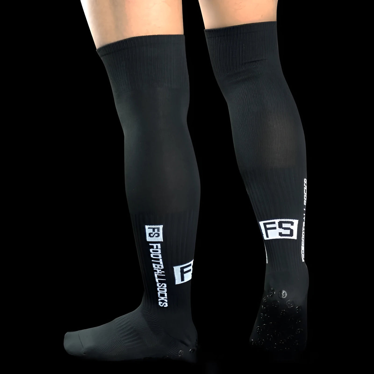 Anti-slip dispensing knee-length football socks in polyester, available in ten colours including black, white, red, and blue.