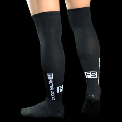 Anti-slip dispensing knee-length football socks in polyester, available in ten colours including black, white, red, and blue.