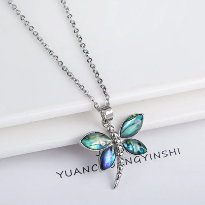 Abalone shell pendant necklace with copper electroplated animal zodiac design and butterfly or dragonfly detail