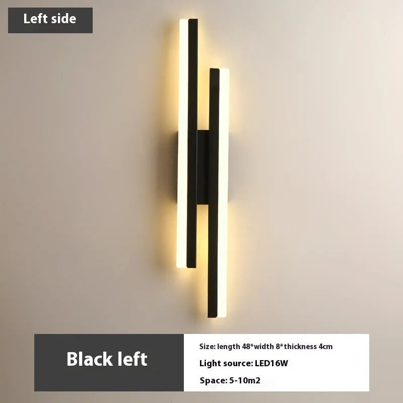 Scandinavian minimalist LED wall light with acrylic shade and adjustable arm in black or gold finish.
