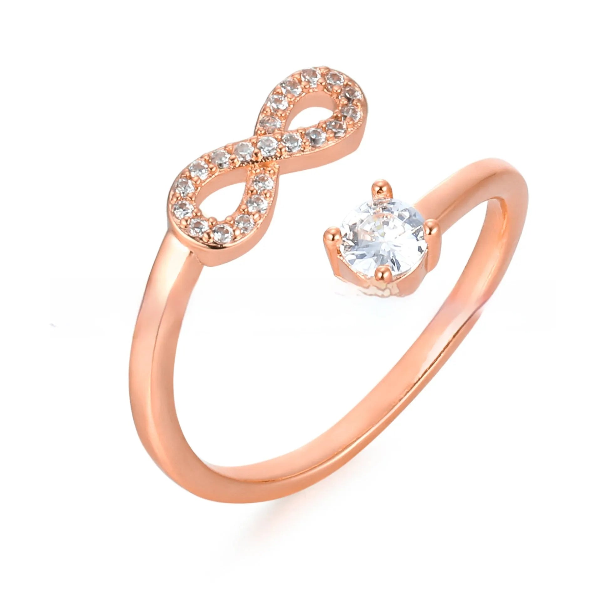 Gold geometric open ring with inlaid zircon stones and an engraved letter