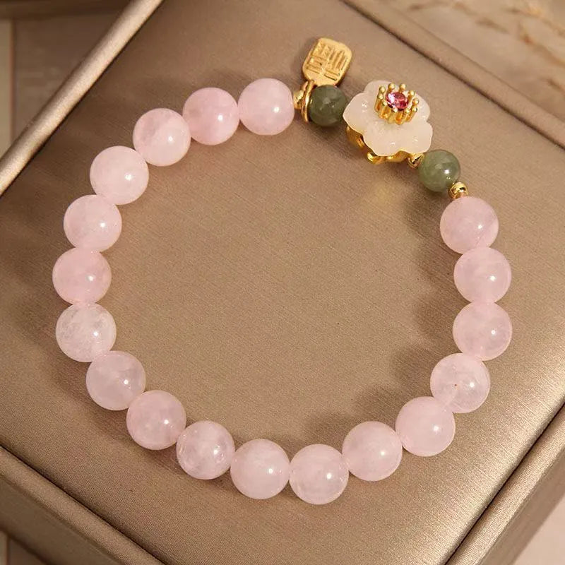 Crystal bracelet featuring Hetian jade beads with peach blossom and camellia charms in pastoral national style for women's jewellery, adjustable length for versatile wear with blessing card colour option.