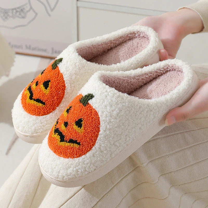 Pumpkin-shaped slippers in white and black colors, featuring a cozy cotton lining and non-slip rubber sole for comfortable indoor wear.