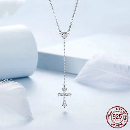 Silver cross pendant necklace with V-neck design on O-ring chain