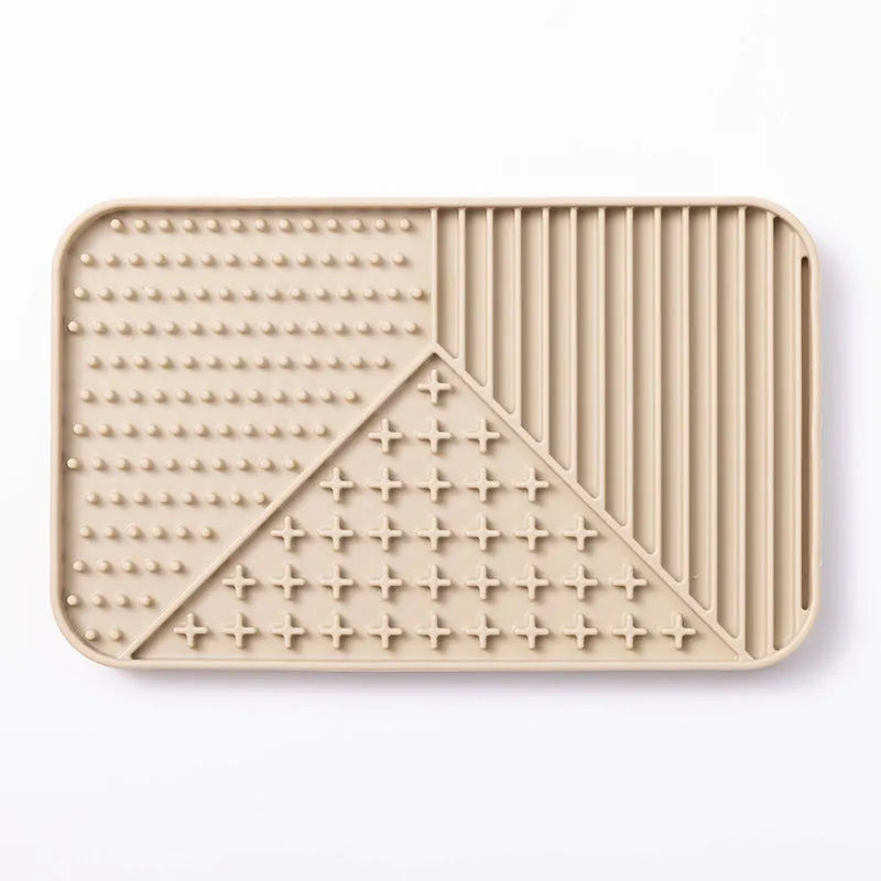 Silicone pet licking mat with suction cup base in pink, grey, or khaki colour options for slow feeding dogs and cats.