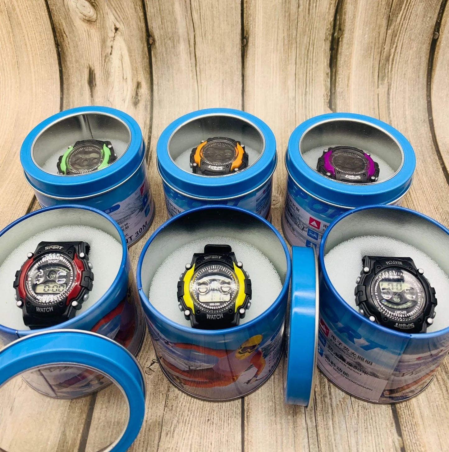 Digital sports watch for children with silicone strap, plastic case, and mixed colour display