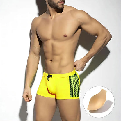 Men's yellow and black polka dot print swimming boxers with briefs style and quick-dry nylon fabric.