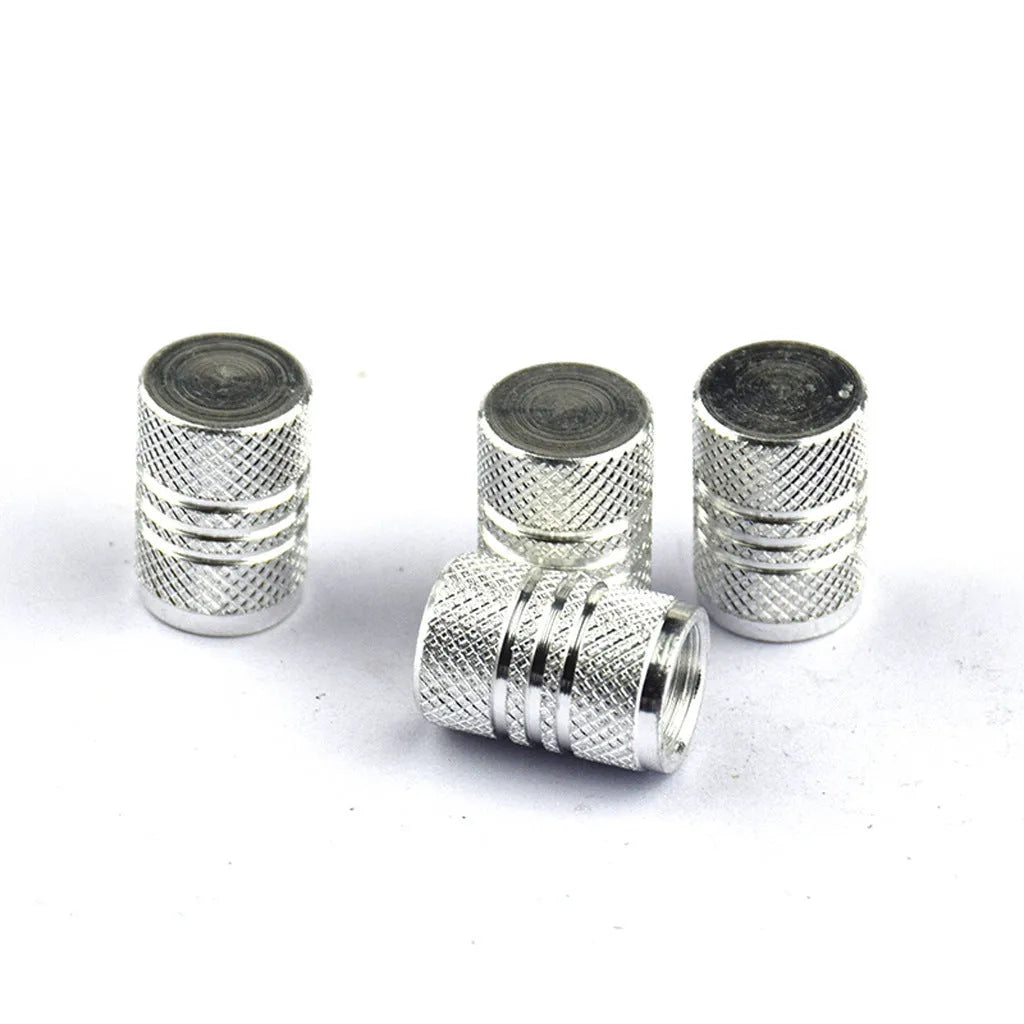 Set of stainless steel car tyre valve caps in multiple colours: black, red, blue, gold, silver, green, purple, sky blue, grey, orange.