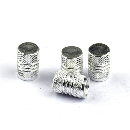 Set of stainless steel car tyre valve caps in multiple colours: black, red, blue, gold, silver, green, purple, sky blue, grey, orange.