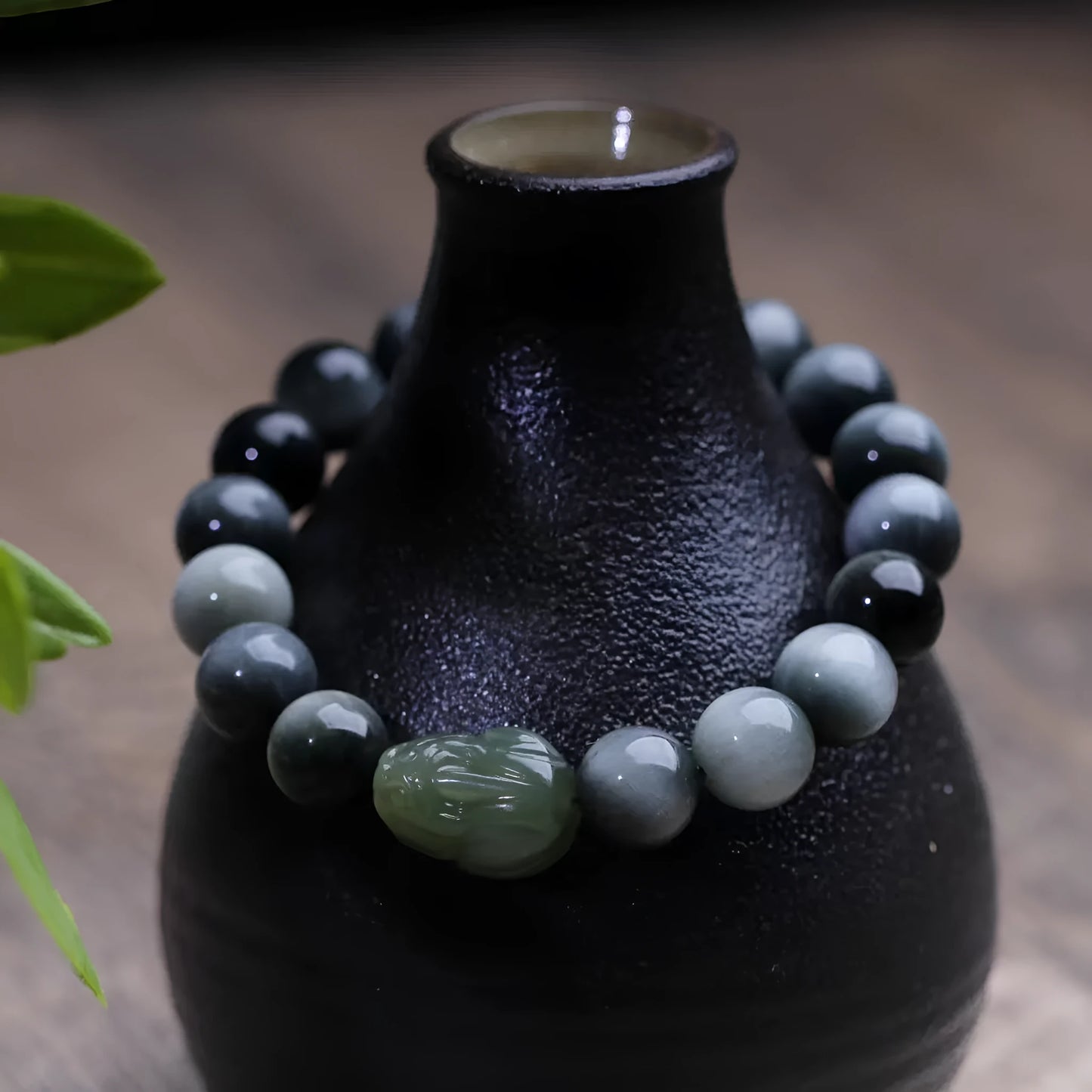 Black bracelet with 10mm Eagle Eye Stone beads and genuine Hetian jade Pixiu pendant