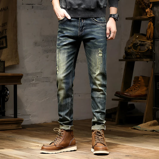 Men's skinny fit stretch denim jeans in retro colour with zip fly, shown in leisure setting.