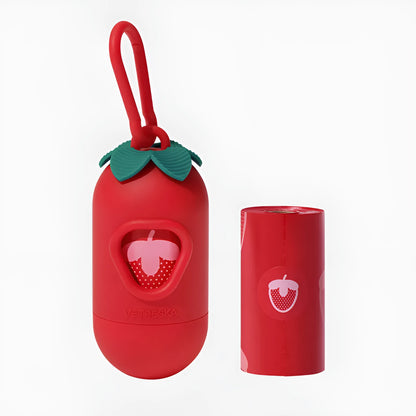 Plastic dog poop bag dispenser capsule clipped to a lead next to a roll of scented waste bags.