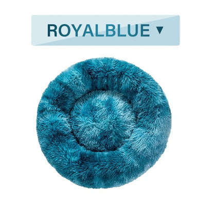 Fluffy donut-shaped dog bed in dark grey colour with raised edges, showing plush texture and circular design