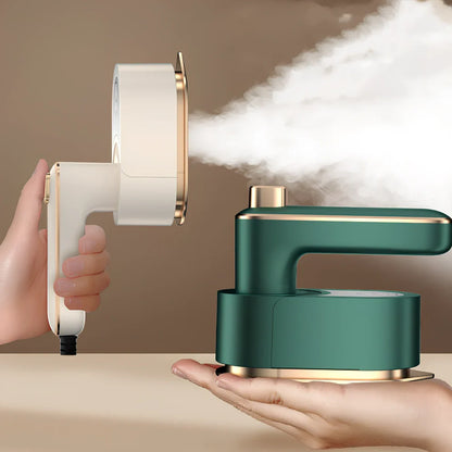 Green folding handheld garment steamer showing extended and collapsed positions with water tank visible