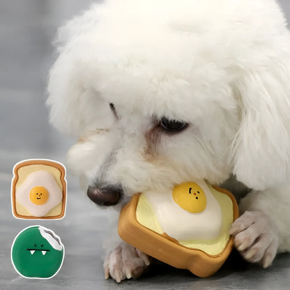 Green and yellow cartoon egg bread shaped latex dog chew toy with squeaker.