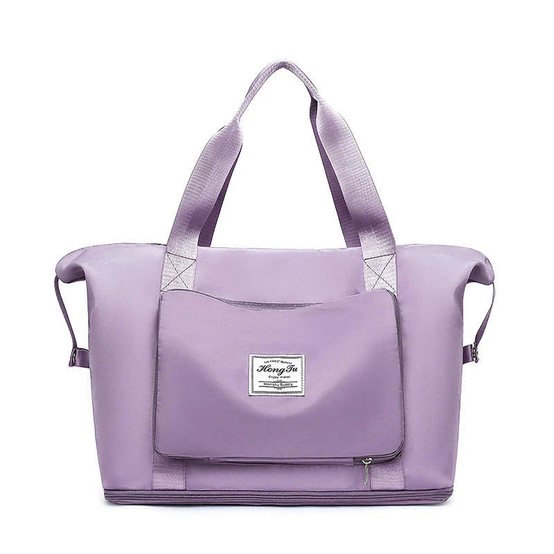 Roomy and foldable gym bag for women with waterproof Oxford fabric, multiple pockets, and wet/dry separation compartment