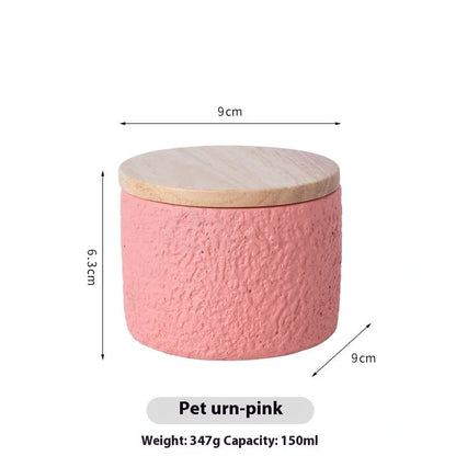 Handmade cement cinerary casket for pet ashes in six colours: black, grey, green, pink, white, yellow