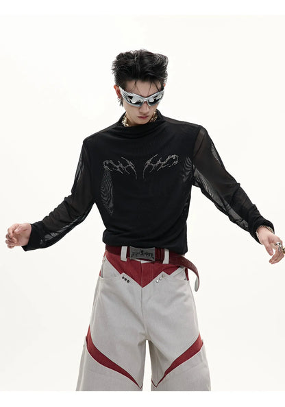 Man wearing a black slim-fit niche mesh long sleeve base layer shirt.