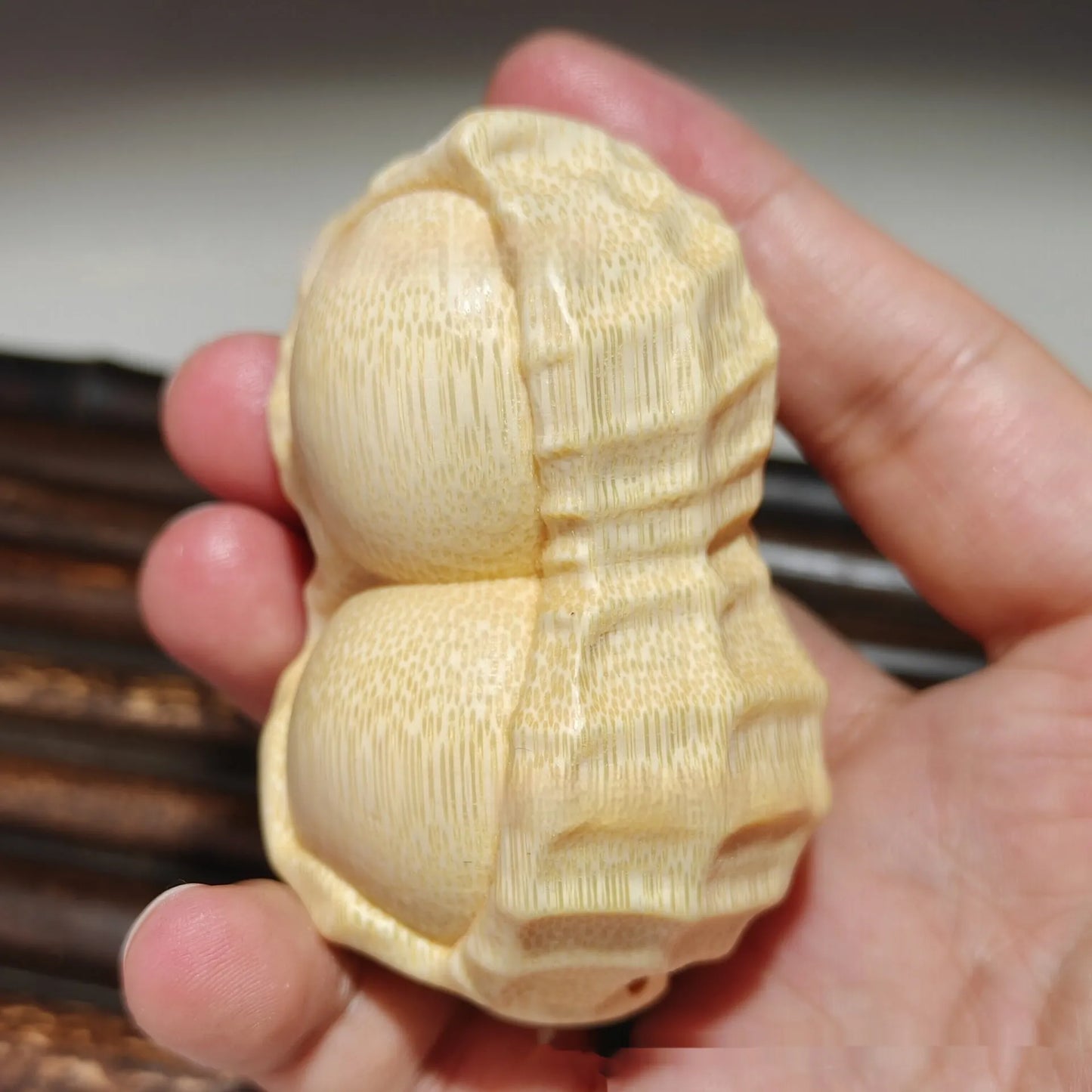 Hand-carved solid bamboo peanut ornament with modern design for gifting and decor