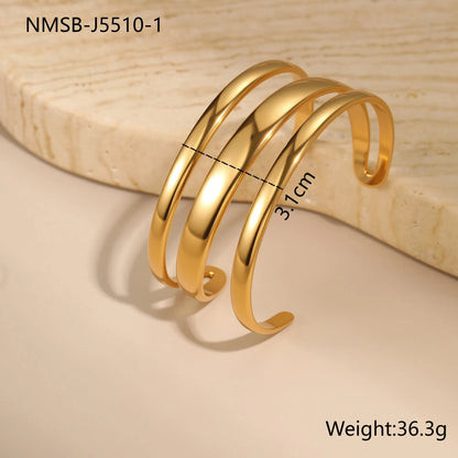 Women's stainless steel bracelet with geometric line design and simple opening clasp in gold electroplated finish
