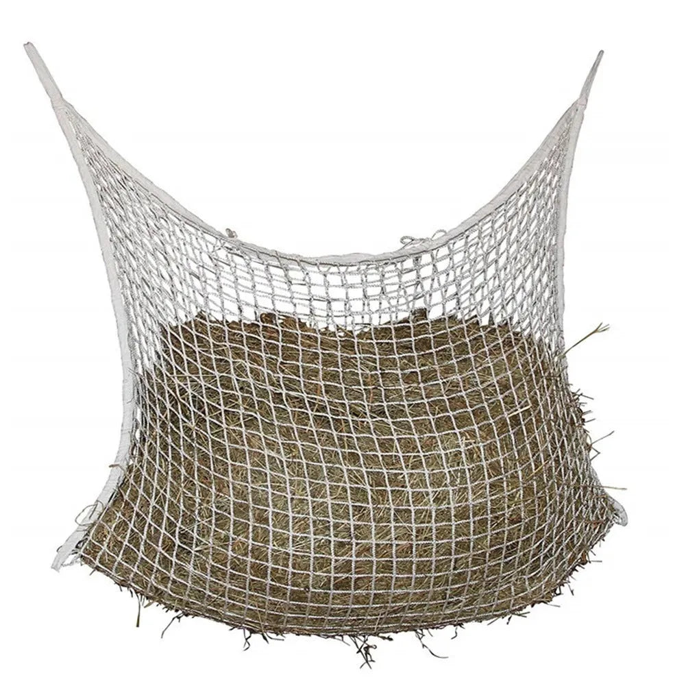 Black woven grid hanging feeding bag for horses, shown against a stable background.