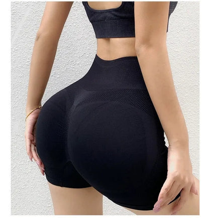 Women's high-waisted black seamless yoga shorts for fitness and running.