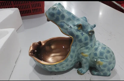 Handmade blue resin hippo storage figurine with removable top showing interior compartment
