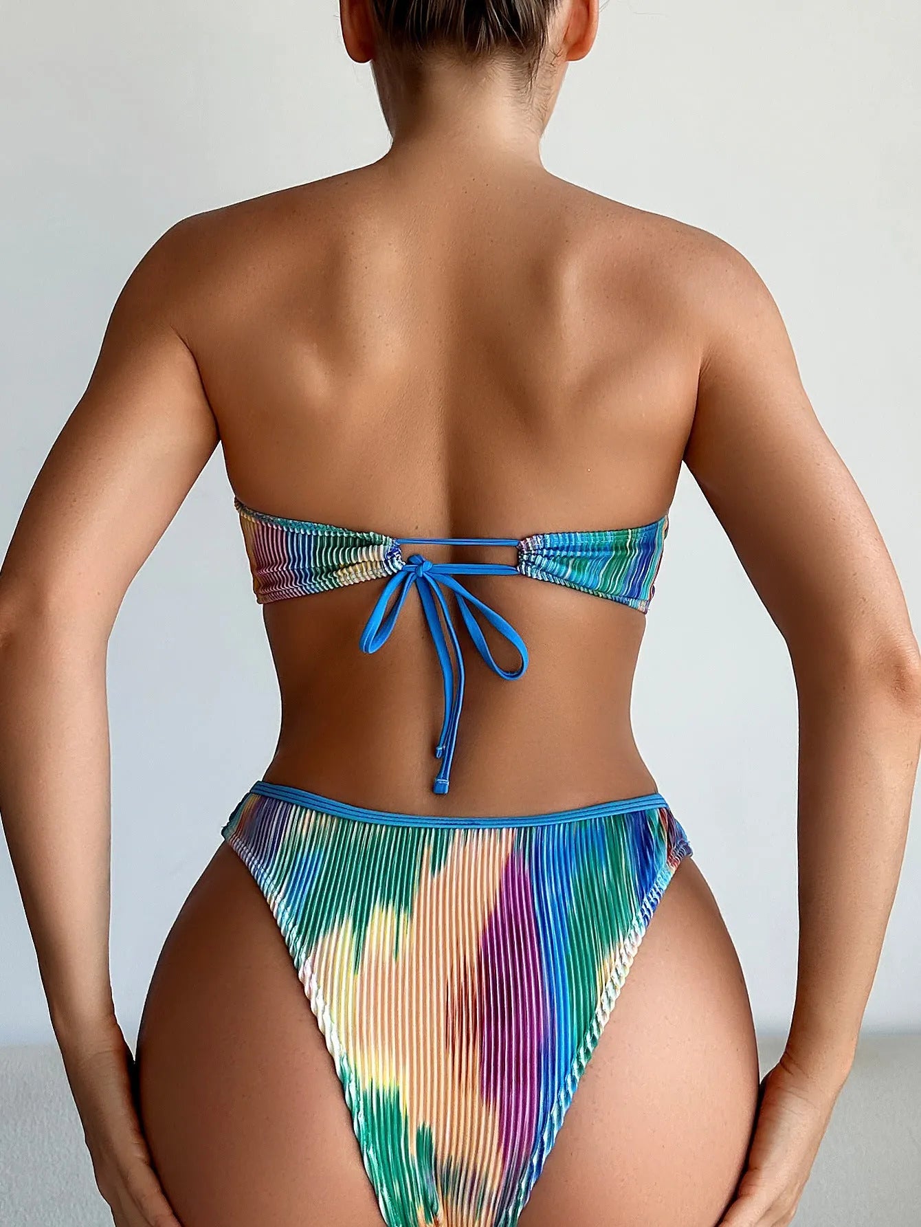 Women's colour printed tube top bikini set with matching briefs on a mannequin.