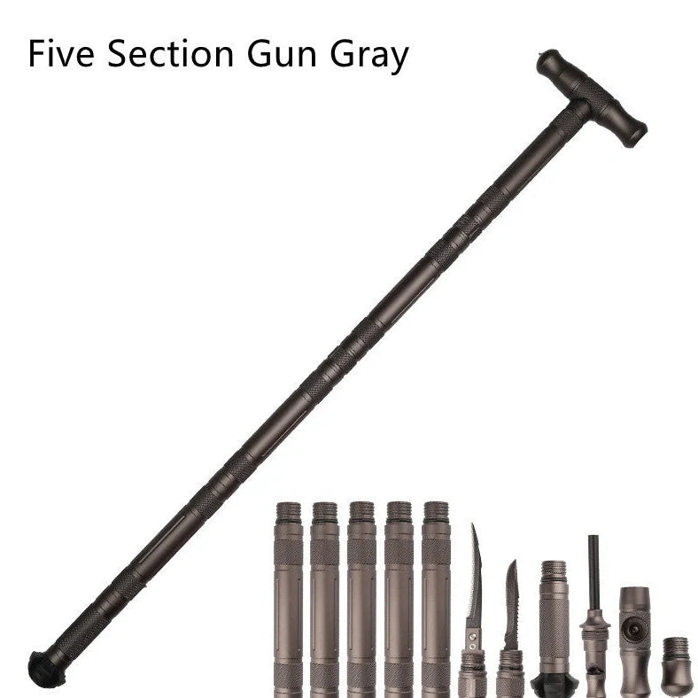 T-shaped telescoping hiking stick with compass, whistle, cutting edge, and glass breaker tip in black or gun grey finish