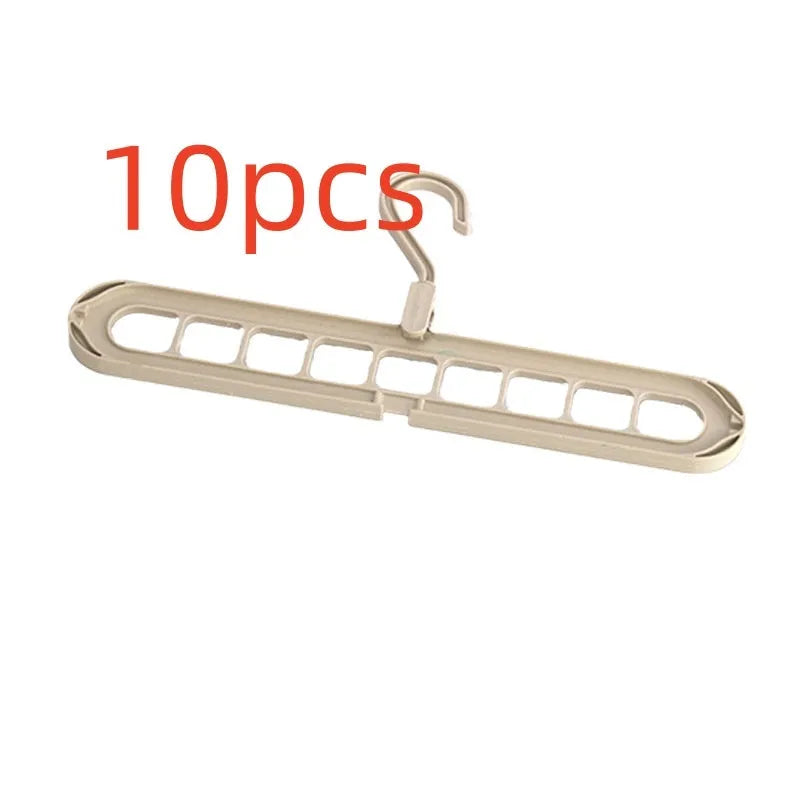 Green nine-hole folding hanger with trousers organised across nine hanging points, showing 45cm width