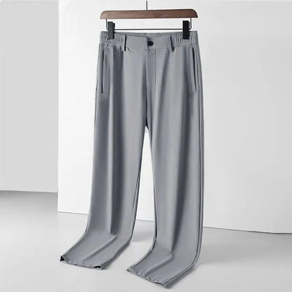 Men's black Ice Silk straight leg leisure trousers with elastic waistband laid flat