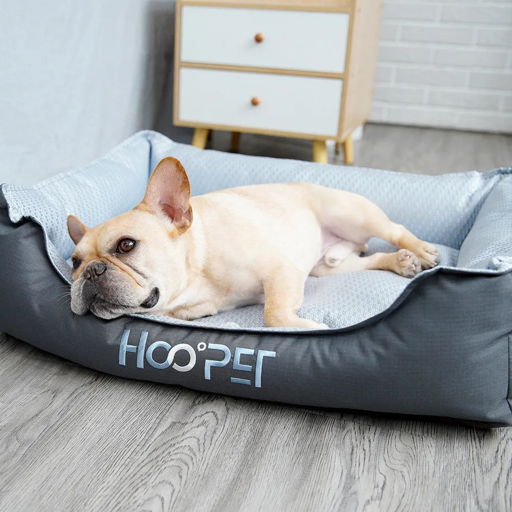 Soft grey dog bed with removable cover showing sizes for small, medium, and large pets