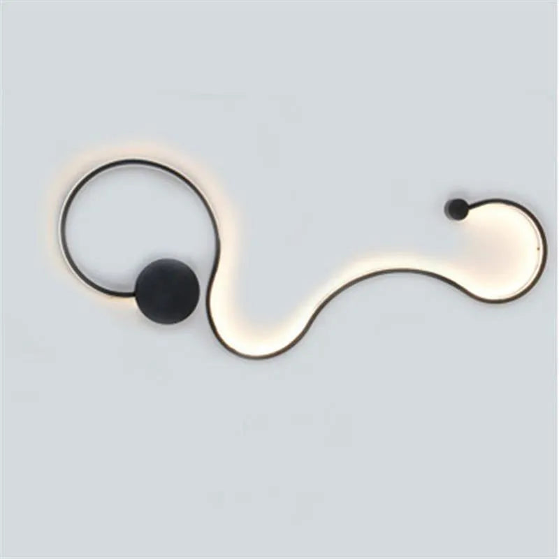Modern black and white LED wall lamp with aluminium shade in four different sizes for bedside or corridor lighting