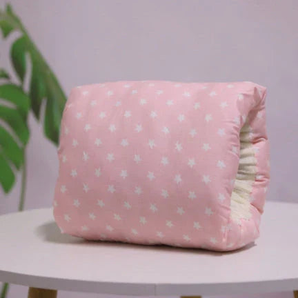 Adjustable cotton nursing pillow with various colorful designs, providing comfort and support for breastfeeding and bottle-feeding