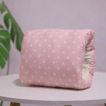Adjustable cotton nursing pillow with various colorful designs, providing comfort and support for breastfeeding and bottle-feeding