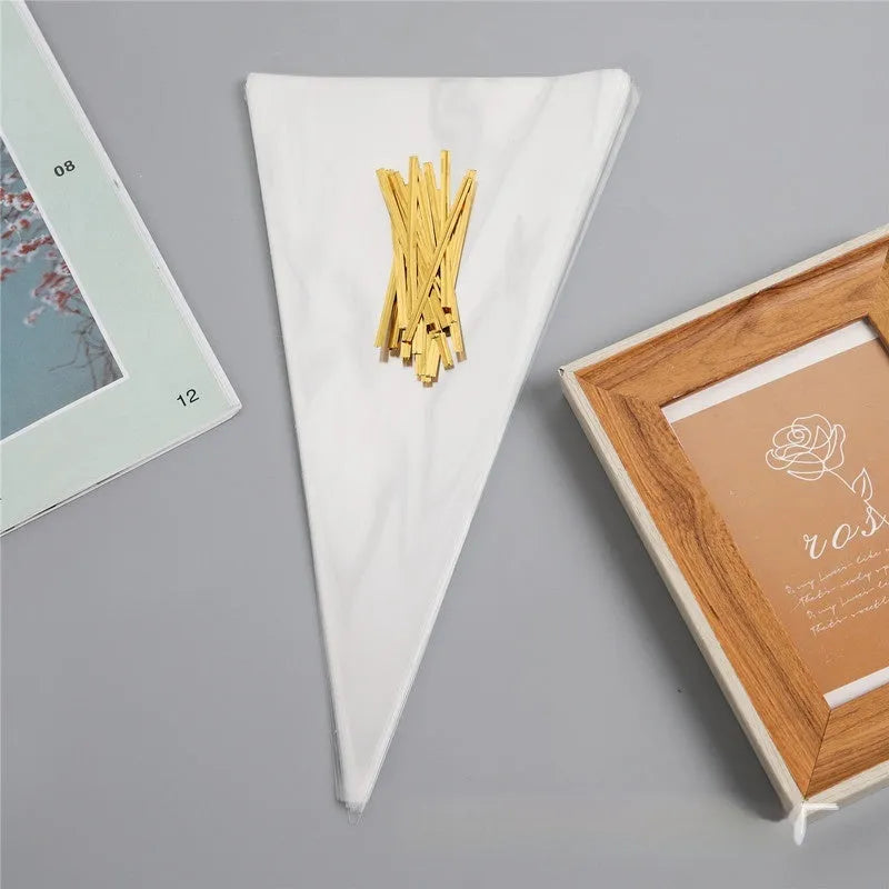 Transparent triangle plastic packaging bag with a twisted wire tie closure.