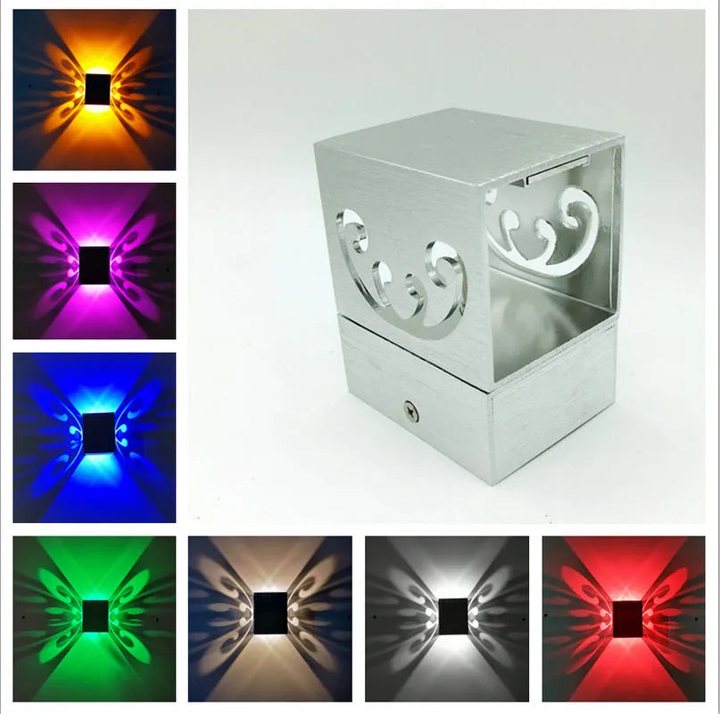 Modern aluminium butterfly-shaped LED wall lamp with remote control for colour changing.