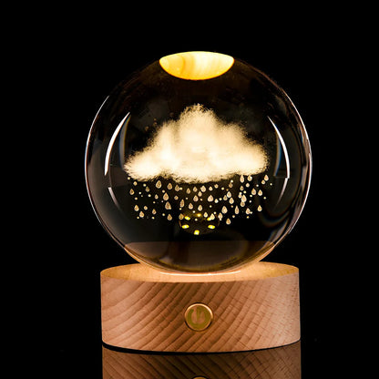 Transparent crystal ball with 3D laser inner carving of galaxy patterns on charging base