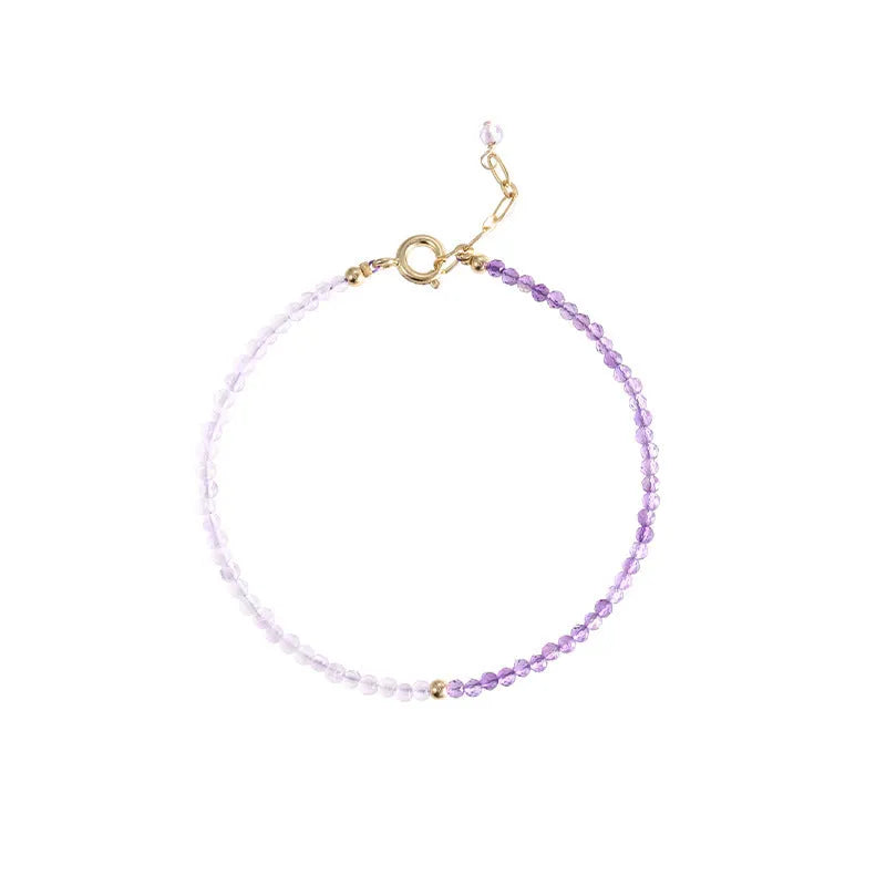 Purple geometric crystal bracelet threaded on 2mm purple rattan.