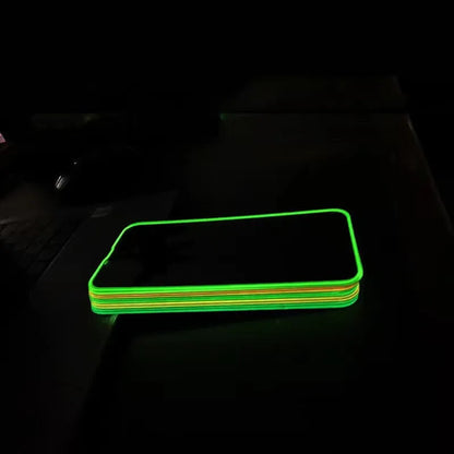 Fluorescent tempered glass screen protector glowing in blue for iPhone with full-screen coverage