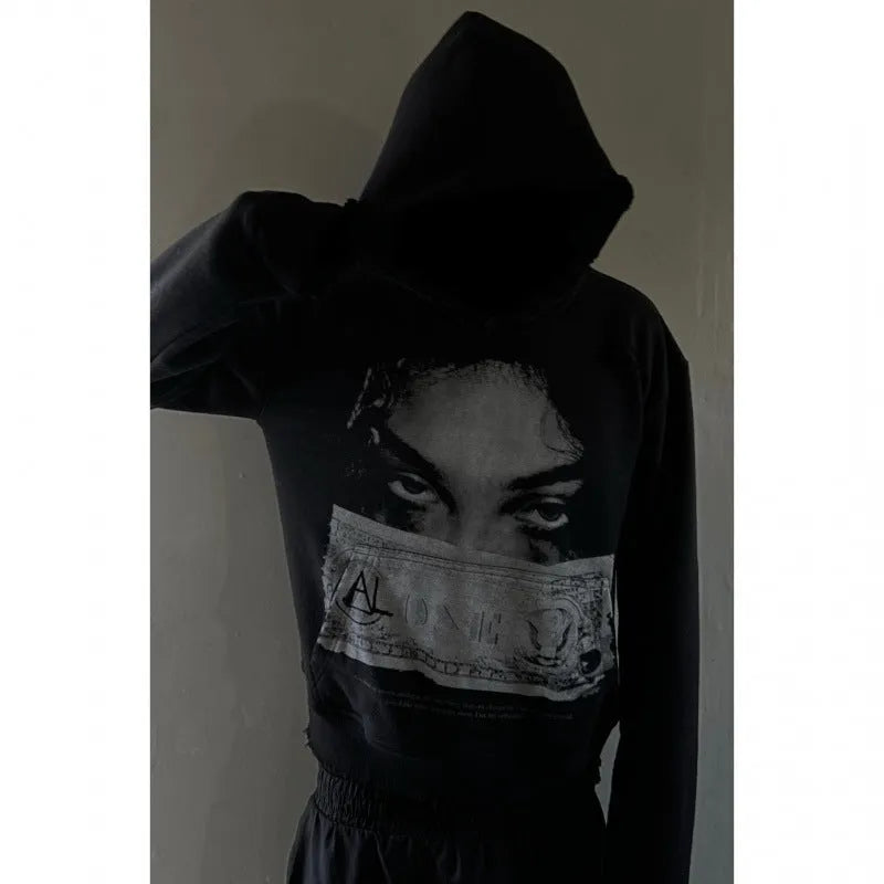 Black women's hoodie with cartoon print design in loose fit polyester construction