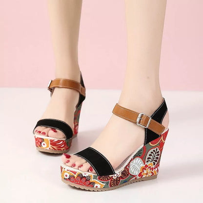 Women's floral embroidered high wedge sandals with buckle strap in black, green, and orange