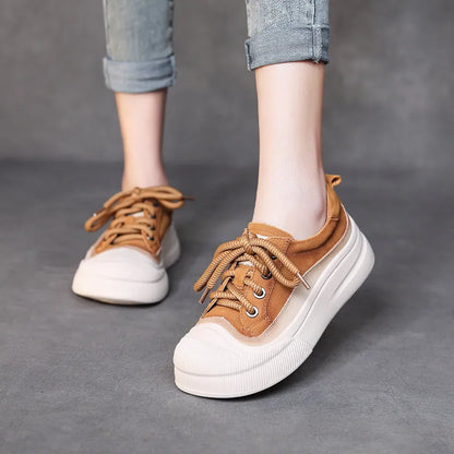 Women's brown leather lace-up casual shoes with round toe and rubber sole on white background