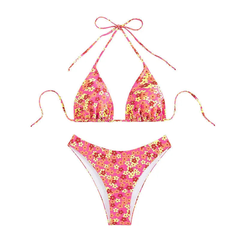 Blue printed women's bikini set with lace-up front top and high-leg split shorts on a mannequin.