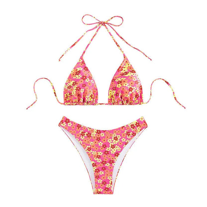 Blue printed women's bikini set with lace-up front top and high-leg split shorts on a mannequin.