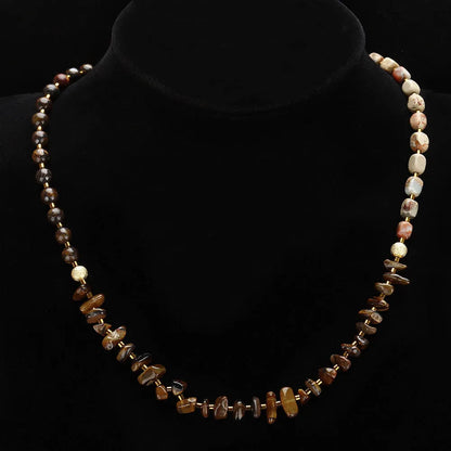 Brown geometric tigereye and bronze bracelet with textured bends and hitches detailing